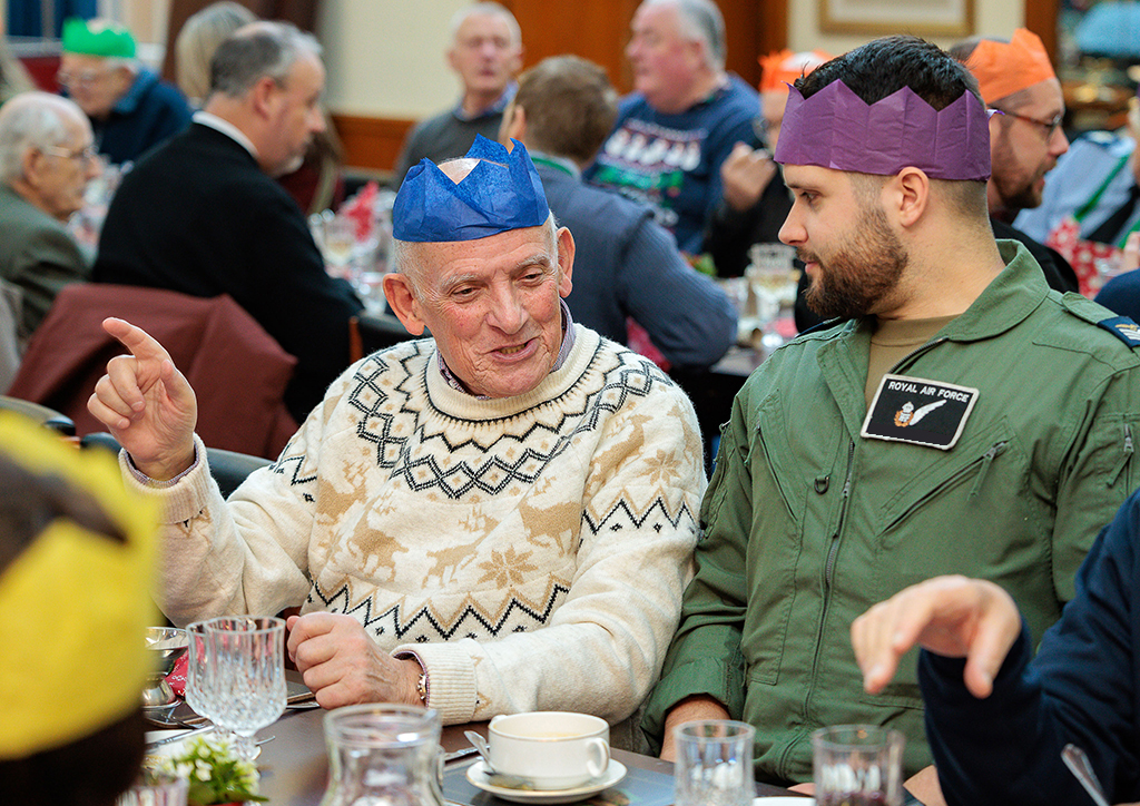 This photo shows a veteran discussing things with an aircrew member